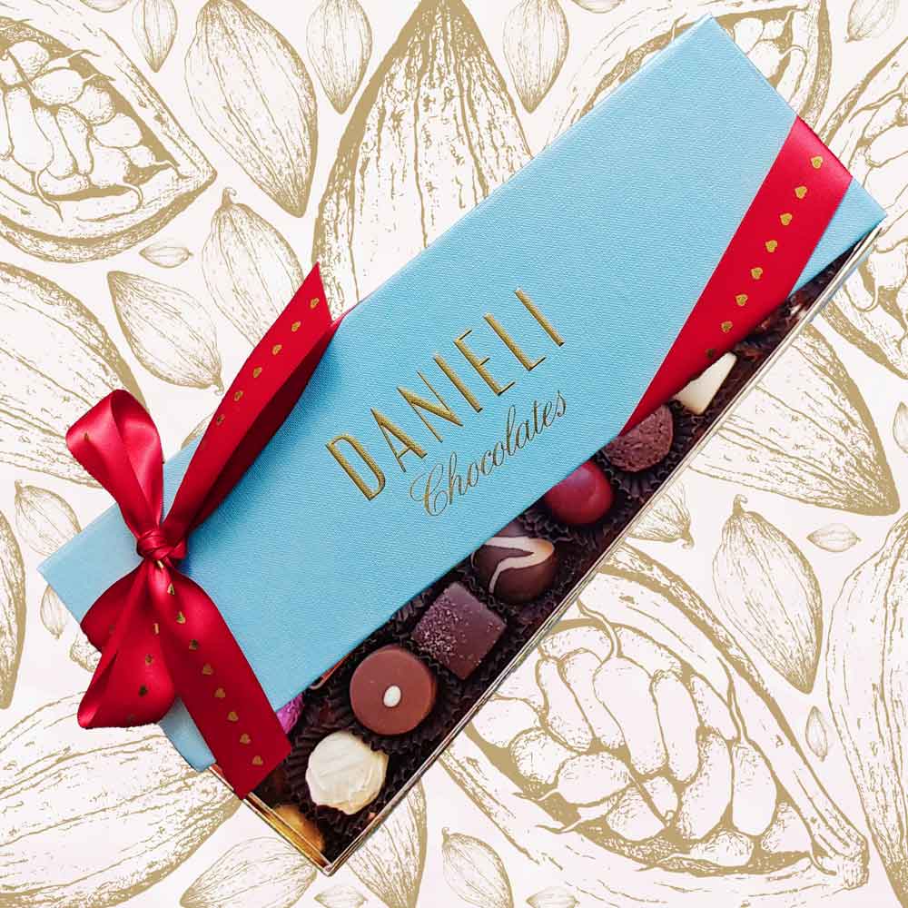 Chocolates for Valentines with 18 chocolates with a red and gold heart ribbon
