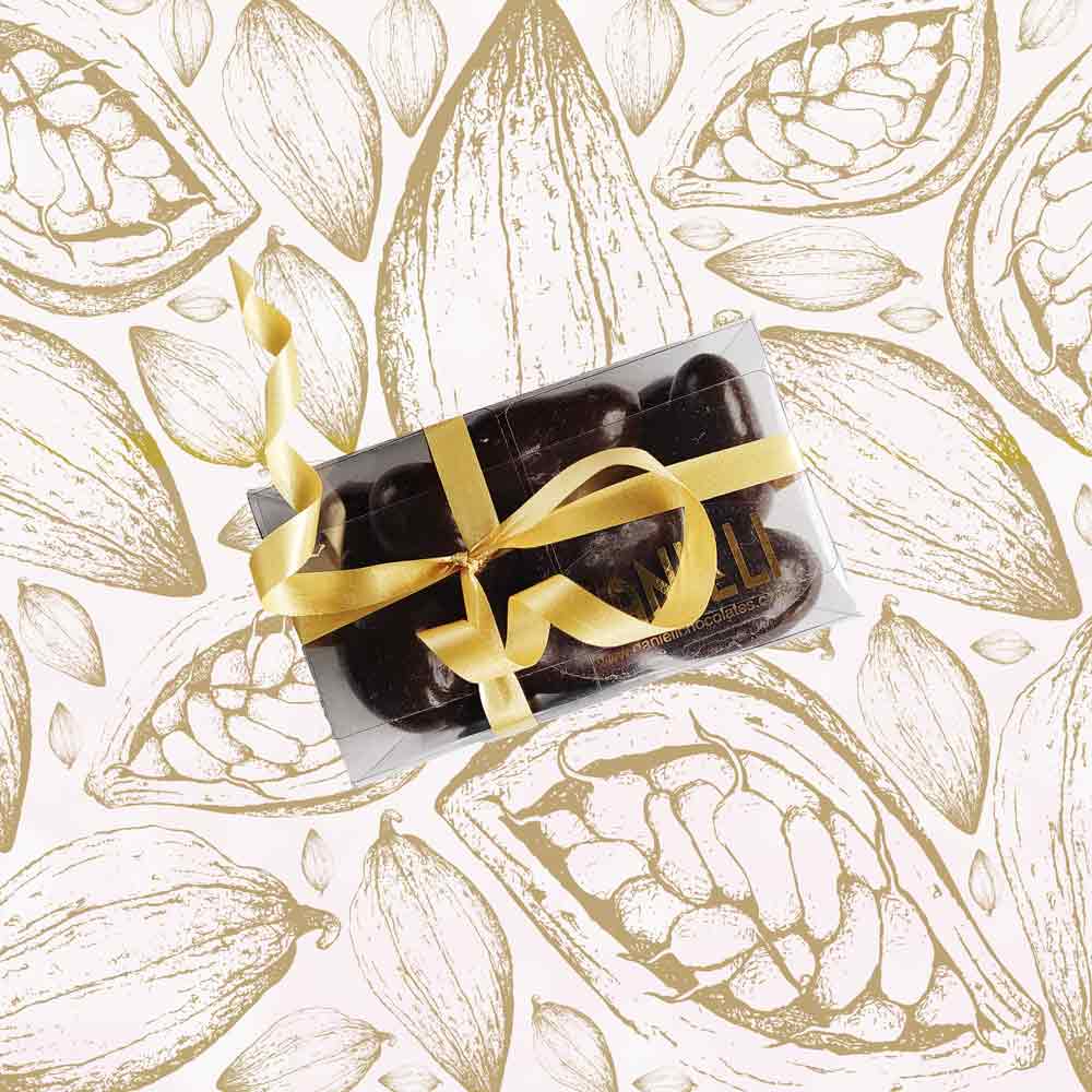 top view of a gift box of Danieli dark chocolate brazils on a cacao background
