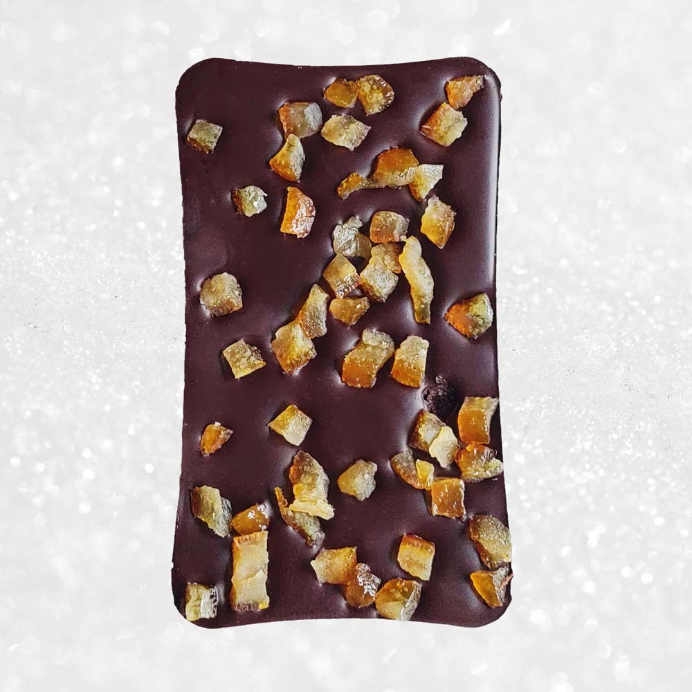 whole bar of Danieli dark chocolate orange bar on a snowy background