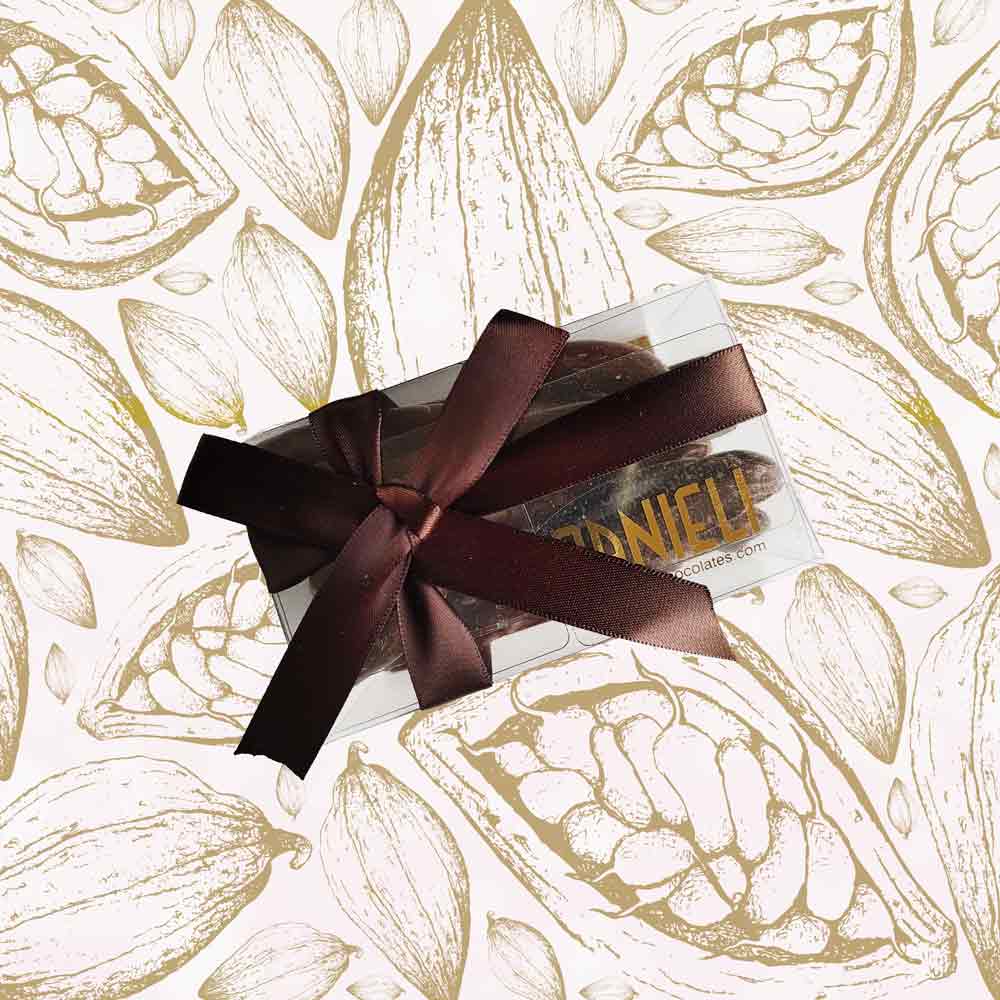 top view of a gift box of Danieli orangettes on a cacao background