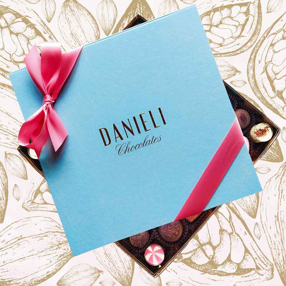 Chocolates for Mother's Day with 60-62 chocolates with a pink ribbon