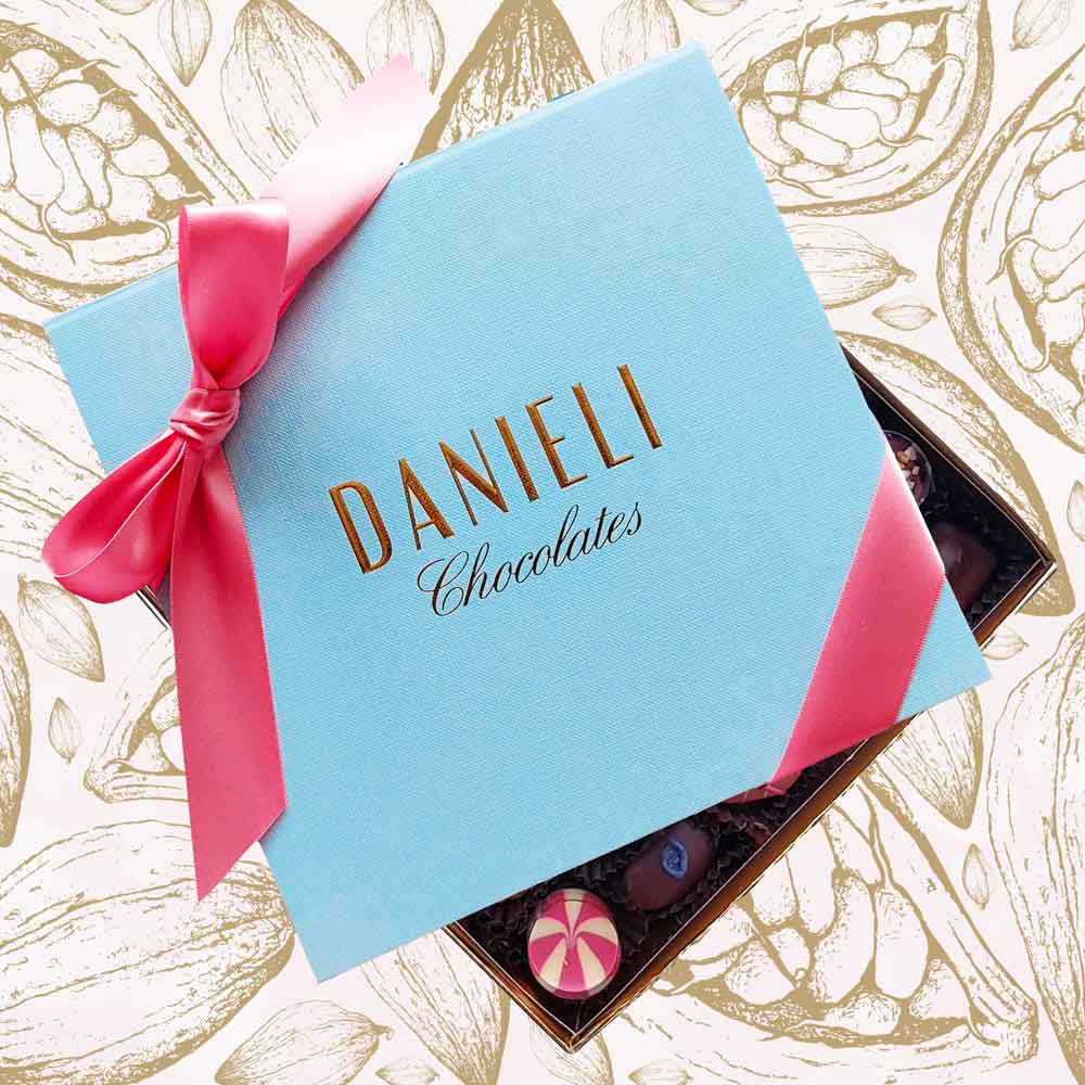 Chocolates for Mother's Day with 32-34 chocolates with a pink ribbon