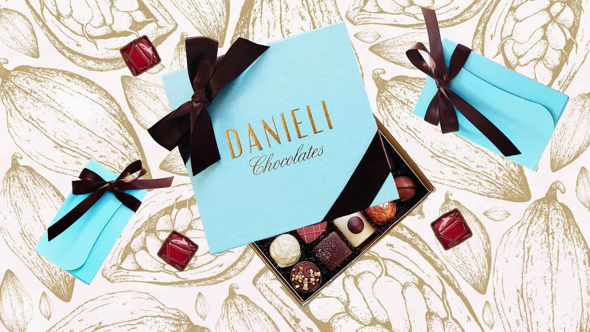 Boxes of Danieli chocolates on a cacao background 