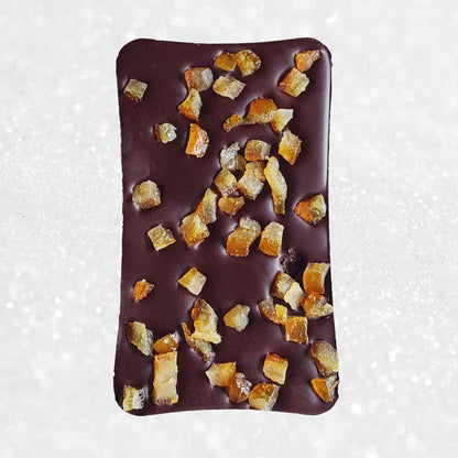 Danieli dark chocolate bar with orange on a snowy background