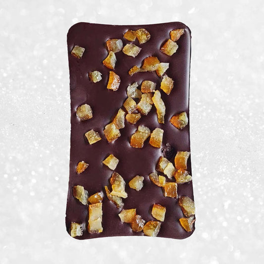 Danieli dark chocolate bar with orange on a snowy background
