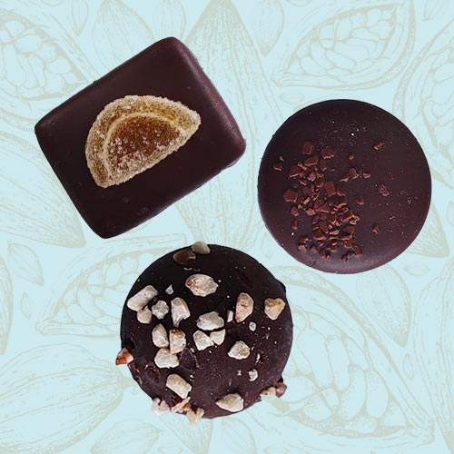 3 Danieli dark chocolates on a blue and brown cacao background