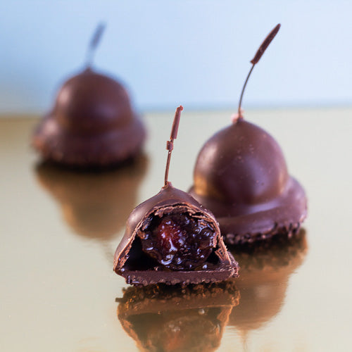 A whole cherry in brandy (including stalk and stone) dipped in thick dark chocolate and finished with chocolate strands.V