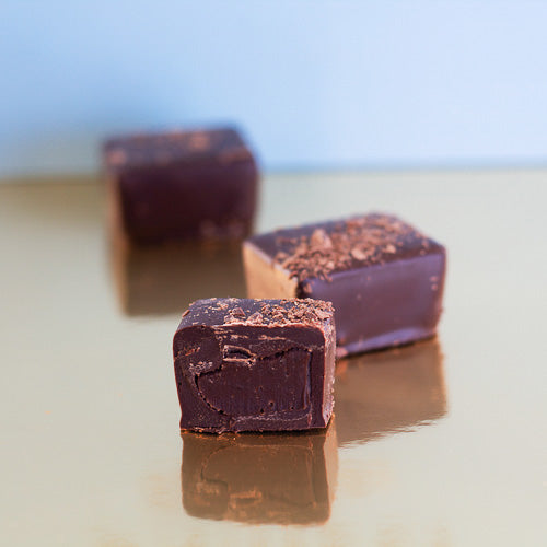 Dark chocolate bitter ganache on a gold background