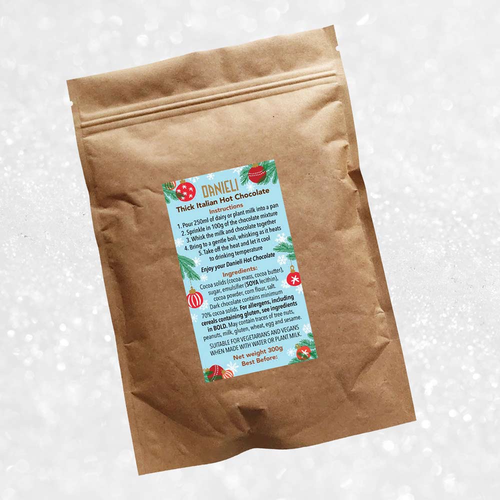 back view of Danieli luxury hot chocolate 300g pouch christmas edition on a snowy background