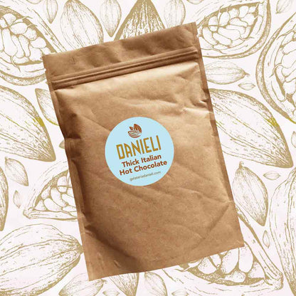 front view of Danieli luxury hot chocolate 300g pouch Classic edition on a cacao background