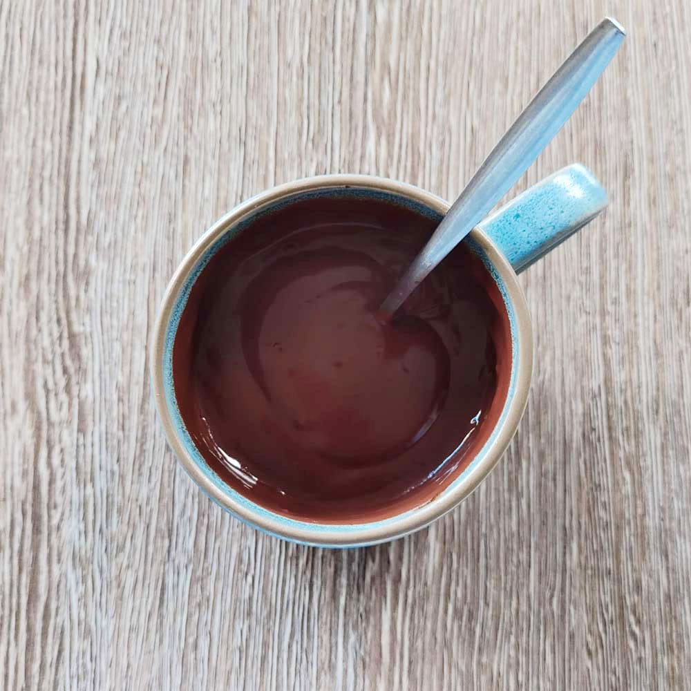 a mug of Danieli thick hot chocolate on a wood background