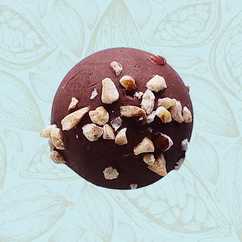 Danieli individual chocolates milk chocolate hazelnut truffle on a blue and brown cacao pod background