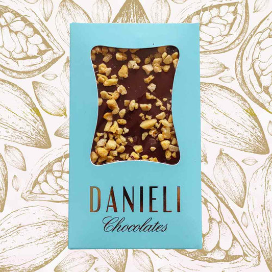Danieli milk chocolate bar with honeycomb on a cacao pod background