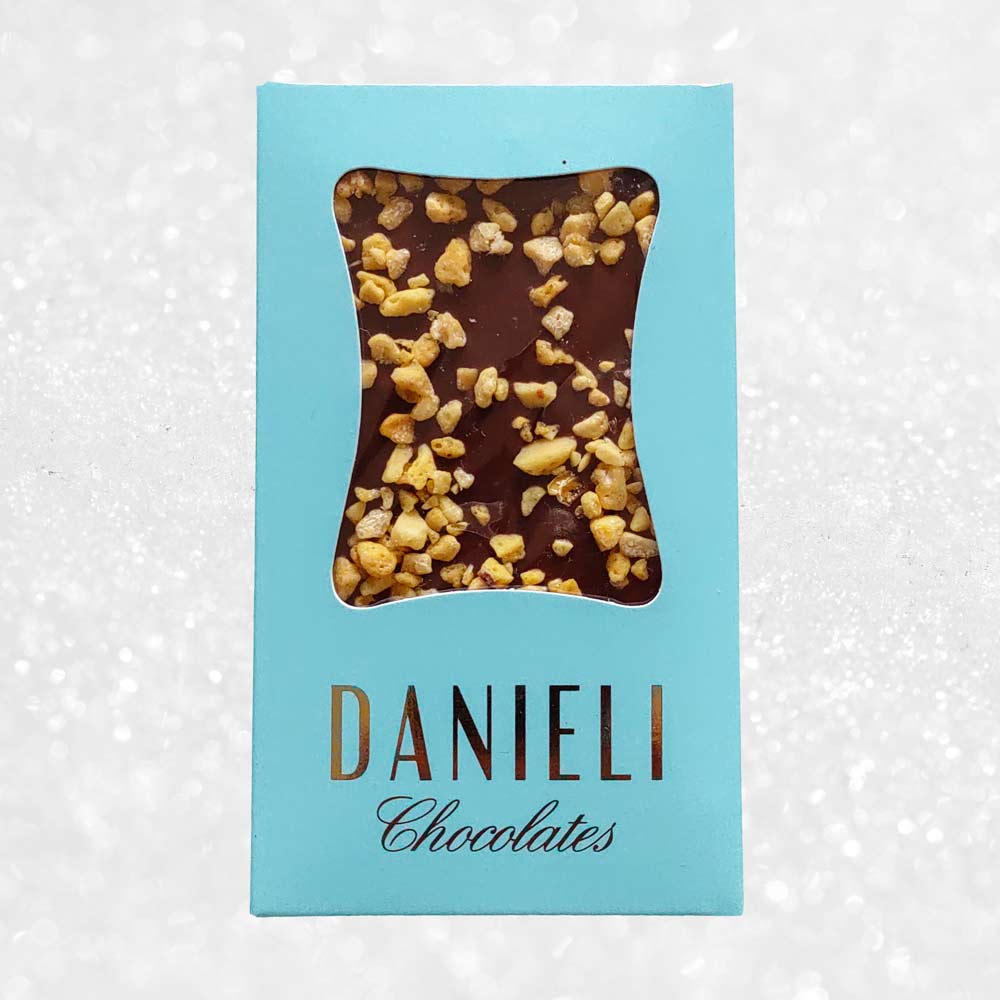 Danieli milk chocolate bar with honeycomb on a snowy background