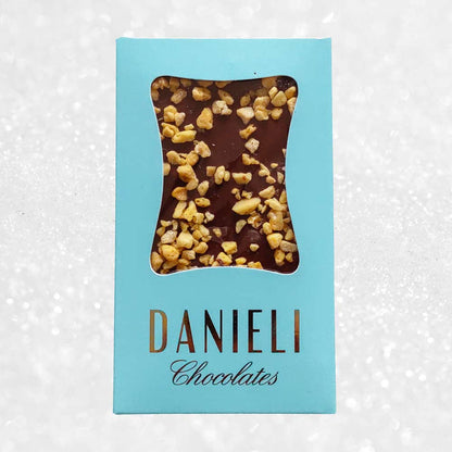 Danieli milk chocolate bar with honeycomb on a snowy background
