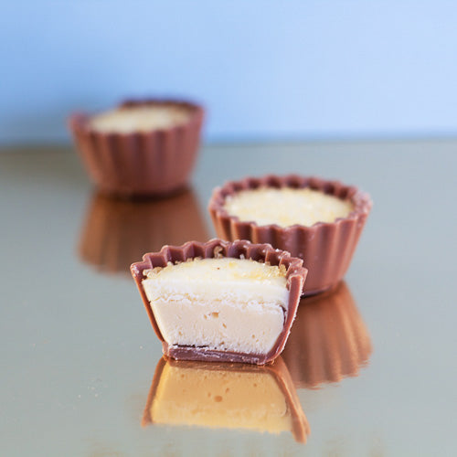 Milk chocolate creme brulee on a gold background