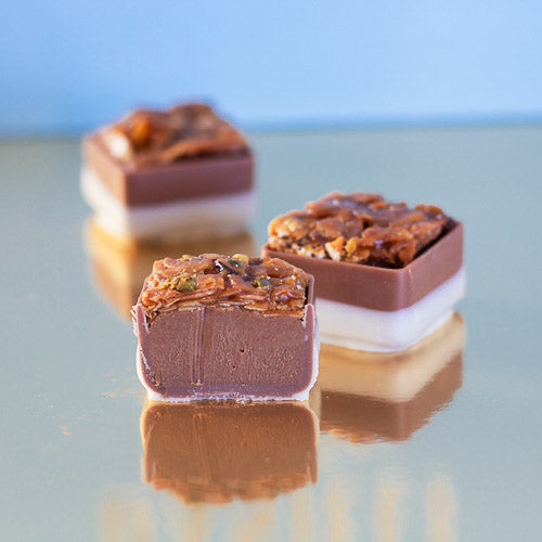 Milk chocolate florentine on a gold background