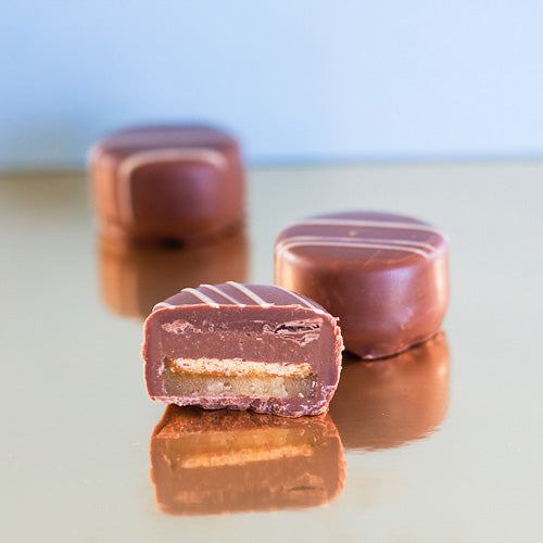 Milk chocolate honey crunch on a gold background