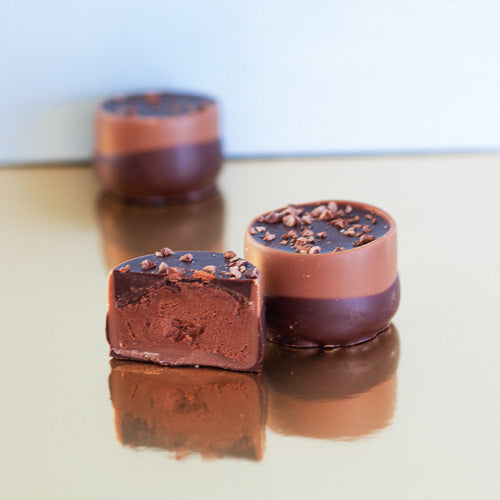 Milk chocolate mousse centre on a gold background