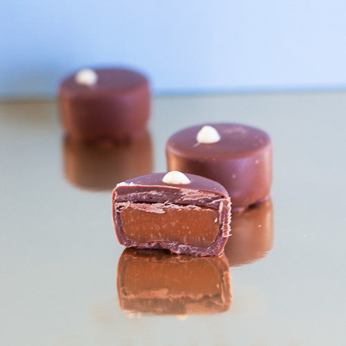 Milk chocolate salted caramel on a gold background