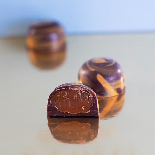 Dark chocolate salted caramel on a gold background