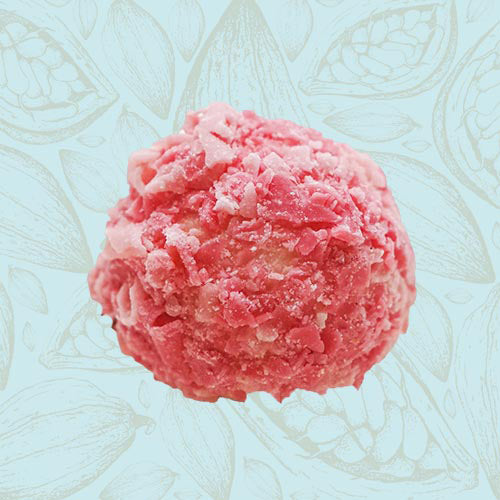 Danieli individual chocolates white chocolate pink champagne truffle on a blue and brown cacao pod background