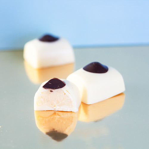 White chocolate mousse centre on a gold background